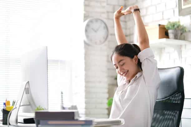 A person stretching her arms Description automatically generated